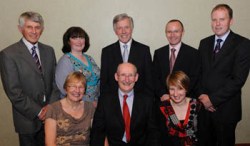 At a reception in Ballinderry Church Hall to mark the retirement of  the Rev Canon Ernest Harris are L to R: (front row) Rev Canon Ernest Harris, Ray Harris and Trish Harris.  (Back row) John Tuft (rector's churchwarden), Edith Haddock (secretary), Robert Yarr (organist), Dr Andrew Sands (vestry) and Andrew Clarke (people's churchwarden).